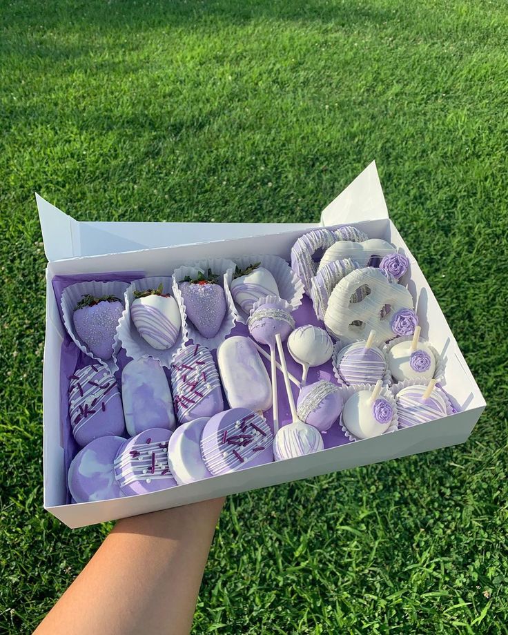 a box filled with lots of purple and white items