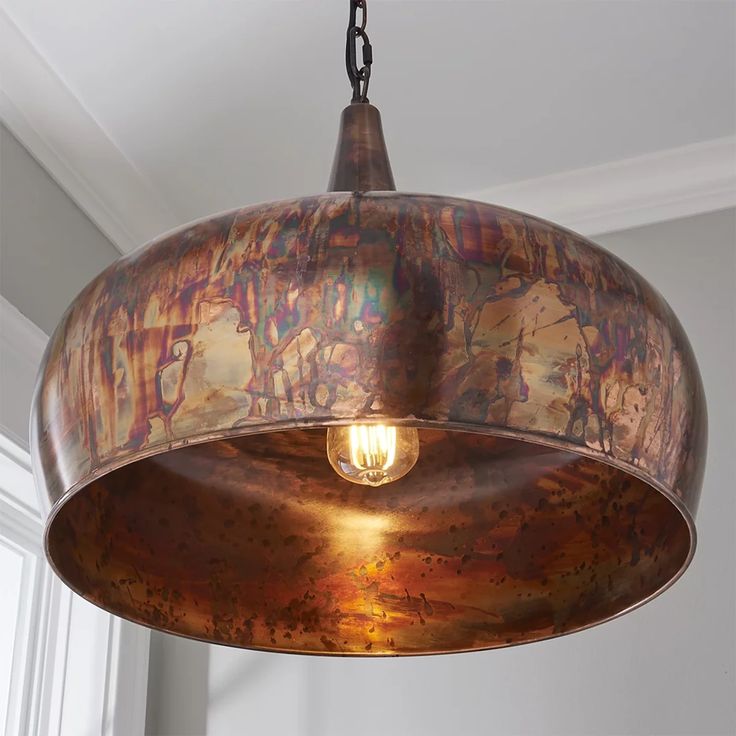 a light fixture hanging from a ceiling in a room