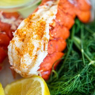 lobster with lemon and dill garnish on the side