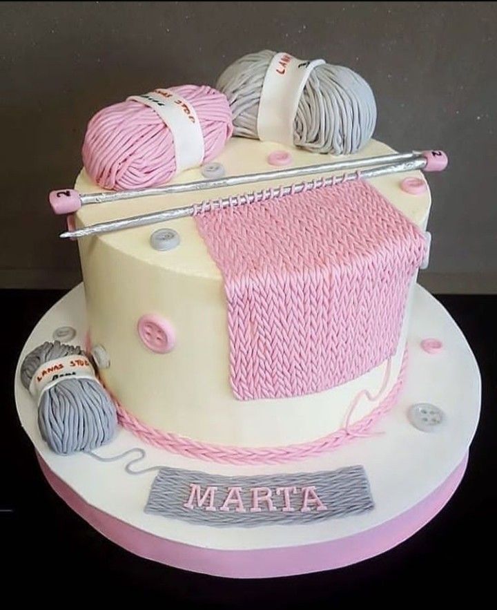 a cake with yarn and knitting needles on it