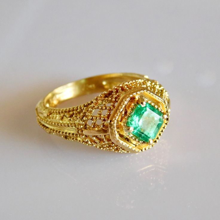 Exquisite geometric avant garde 18k solid Gold Emerald Ring. Material: 18k solid Gold Stone: Pristine AAA+ grade natural Columbian Emerald All our Stones are Ethically sourced. Made with Love at our Temple Jewels studio in ibiza. Custom orders Welcomed! Free world wide shipping. Sizing included For more rings: https://www.etsy.com/shop/templejewelsibiza/items?section_id=21449468 To my shop: https://www.etsy.com/shop/templejewelsibiza Exquisite 14k Gold Emerald Ring, Antique 14k Gold Emerald Ring, Elegant 14k Gold Multi-stone Emerald Ring, 14k Gold Emerald Ring With 17 Jewels - Collectible, 14k Gold Green Emerald Ring, Fine Jewelry, Gold Emerald Ring, New Saree Blouse Designs, Columbian Emeralds, Emerald Ring Gold