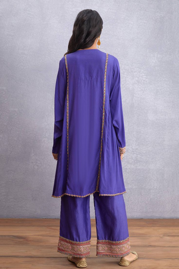 Amethsyt purple kurta highlighted with embroidery, embellishments, notched neckline and full sleeves. Comes with pant.
Components:2
Embroidered
Neckline:Notched
Sleeve Length:Full
Fabric:Kurta: Original Silk Crepe, Pure Cotton Silk; Pant: Handwoven Chanderi, Pure Cotton Silk, Cotton Voile
Color:Purple
Straight kurta
Embroidered pant - Aza Fashions Purple Palazzo Set With Dabka Work And Straight Kurta, Embroidered Purple Sets For Eid, Semi-stitched Purple Palazzo Set With Mirror Work, Purple Chanderi Kurta With Mirror Work, Unstitched Purple Palazzo Set For Navratri, Purple Palazzo Set With Zari Work For Navratri, Purple Semi-stitched Palazzo Set With Mirror Work, Purple Palazzo Set With Dori Work For Eid, Purple Mirror Work Palazzo Set For Eid