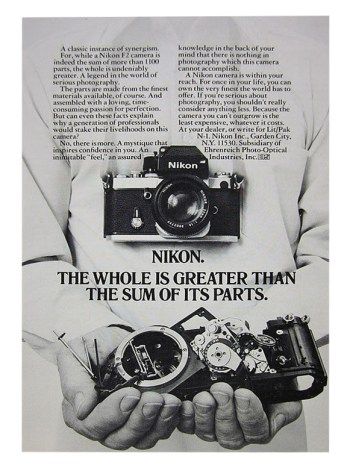 an advertisement for the nikon camera with two hands holding it in front of them