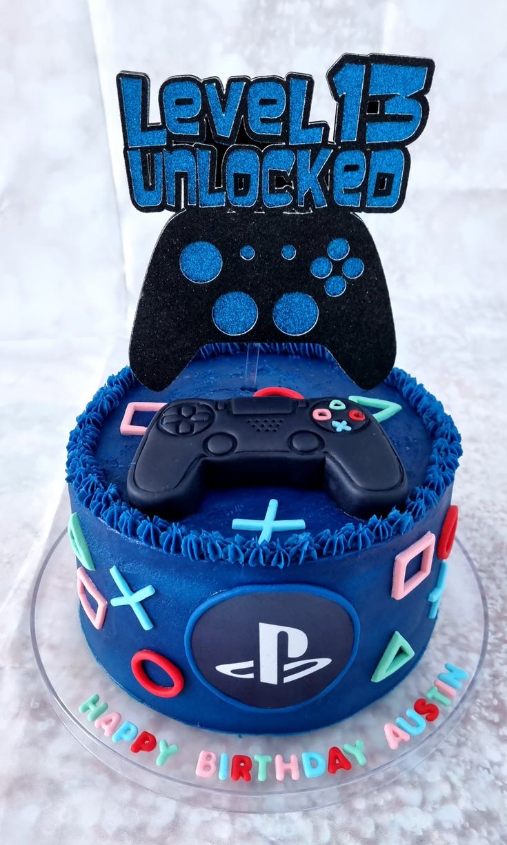 a birthday cake with a video game controller on top