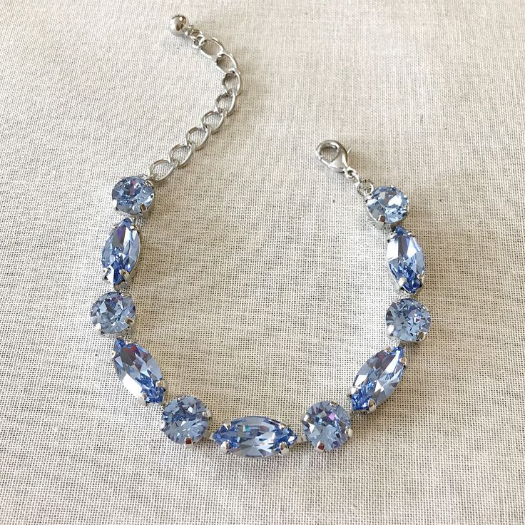 New bracelet now available in my shop. Silver And Blue Bracelet, Sapphire Blue Aesthetic, Baby Blue Jewelry, Light Blue Jewelry, Light Blue Bracelet, Blue Crystal Bracelet, Blue Stuff, Crystal Cluster Earrings, Swarovski Crystal Drop Earrings