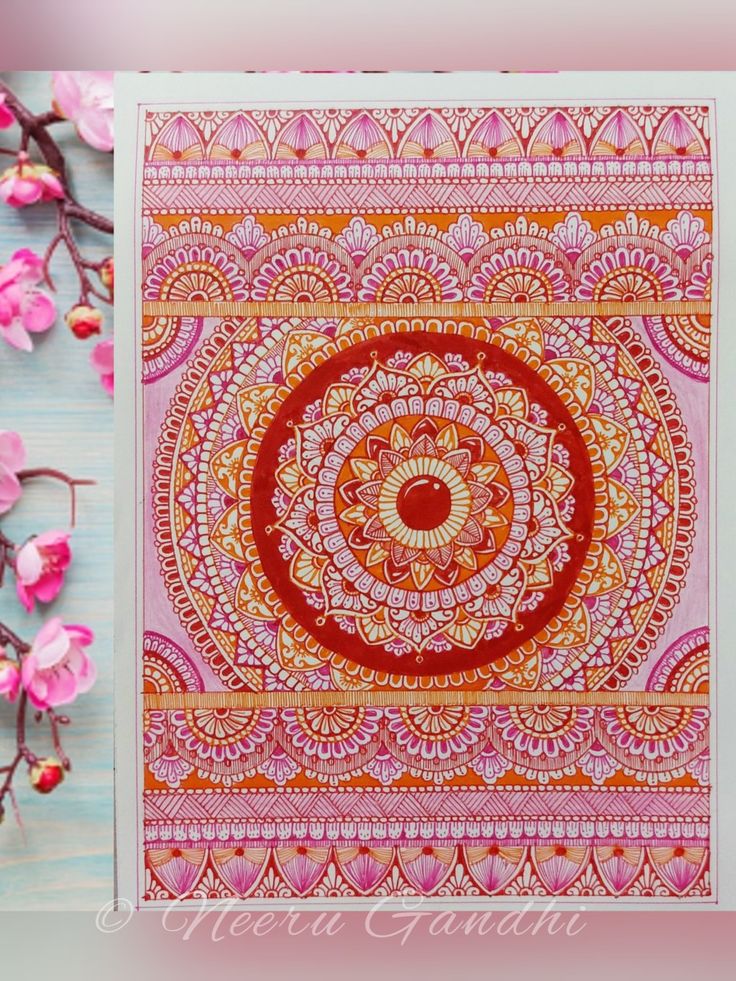 an orange and pink art print with flowers on it, next to a white background