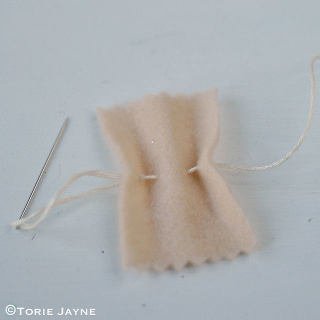 a piece of fabric with a needle in it