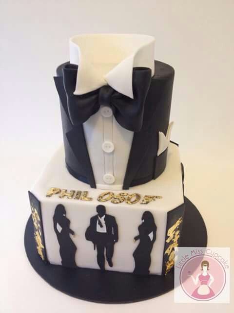 a three tiered cake decorated with the silhouettes of two men in tuxedos