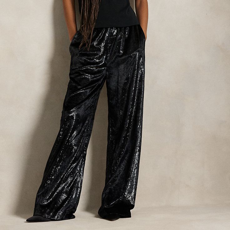 The elegant drape of velvet fabric with a metallic sheen brings a luxe point of view to these pants which are constructed with a wide-leg silhouette. Elegant Ralph Lauren Wide-leg Pants, Chic Ralph Lauren Wide-leg Pants, Luxury Wide Leg Bottoms For Night Out, Luxury Wide-leg Evening Bottoms, Luxury Sequined Bottoms For Formal Occasions, Luxury Wide-leg Pants For Evening, Elegant Velvet Trousers, Velvet Wide Leg Bottoms For Night Out, Luxury Full-length Bottoms For Party