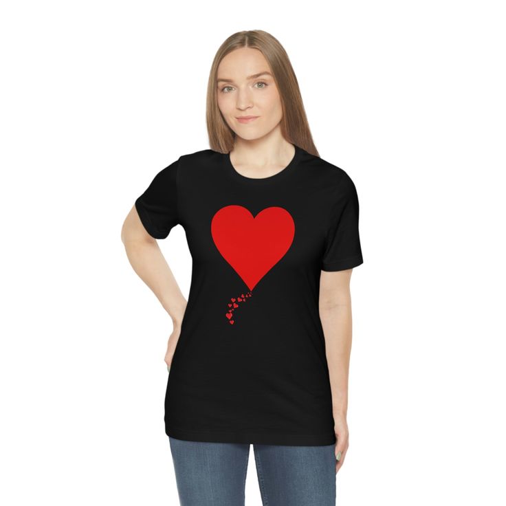 A simple minimalist gesture that tells you how much you are loved. We call this design 'One Heart Forvever' with it's adorable trail of tiny hearts leading to the onen solitary heart. Gift this adorable T-shirt to that special someone who is dear to your heart and watch them beam with pleasure. XS S M L XL 2XL 3XL Width, in 16.50 17.99 20.00 22.01 24.02 25.98 27.99 Length, in 27.01 27.99 29.02 30.00 31.02 32.01 32.99 Sleeve length, in 8.62 8.90 9.17 9.45 9.72 10.00 10.39 Heart Print Short Sleeve T-shirt As Gift, Heart Print Crew Neck T-shirt For Gift, Heart-shaped T-shirt For Valentine's Day, Valentine's Day Heart Graphic Tee, Valentine's Day Heart-shaped Graphic Tee, Black T-shirt With Heart Graphic For Valentine's Day, Valentine's Day Gift T-shirt With Heart Graphic, Valentine’s Day Gift T-shirt With Heart Graphic, Black Short Sleeve T-shirt For Valentine's Day