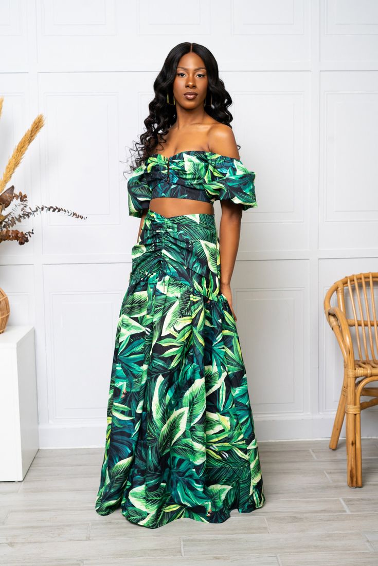 Green leaf crop top with maxi skirt. 100% Polyester Model is wearing a small Green Floor-length Sets For Spring, Green Floor-length Spring Sets, Green Flowy Maxi Dress For Vacation, Green Maxi Dress With Flowy Skirt For Vacation, Spring Two-piece Long Maxi Skirt, Green Crop Top For Vacation, Green Flowy Maxi Dress, Green Flowy Maxi Dress For Spring, Green Maxi Skirt For Vacation