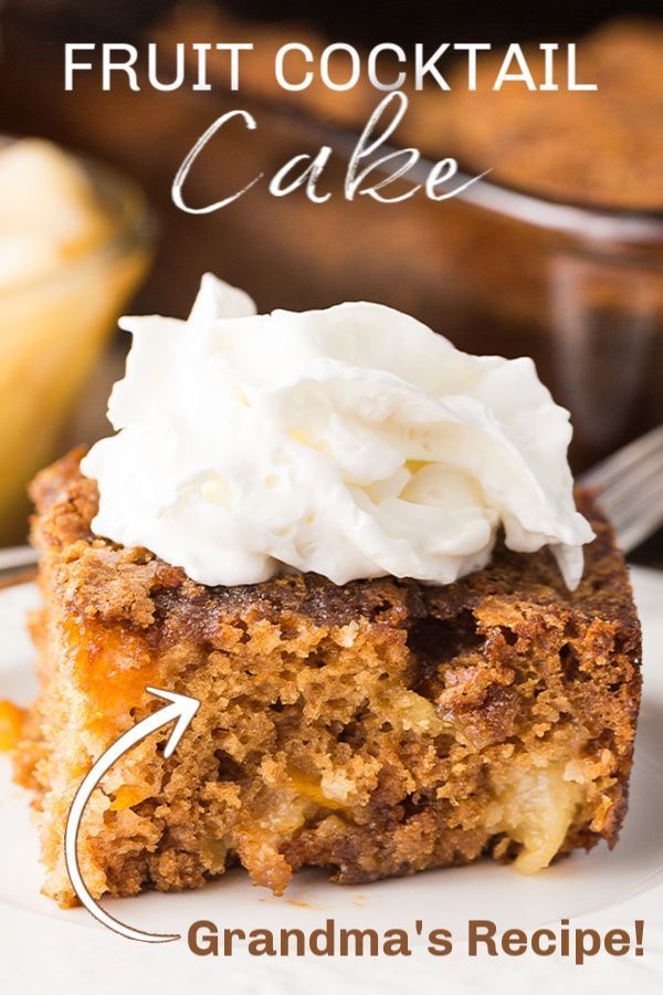 a close up of a piece of cake on a plate with whipped cream in the middle