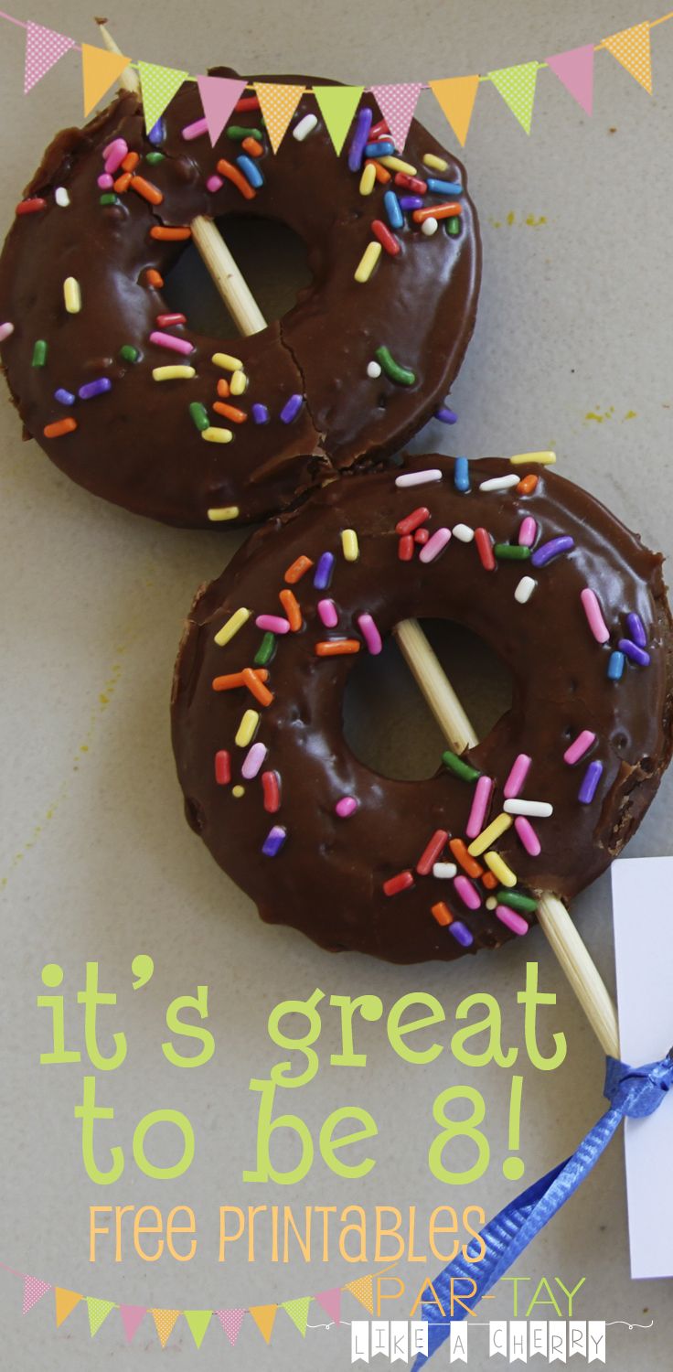 two chocolate donuts with sprinkles are on a stick next to a piece of paper that says it's great to be 8 free printable