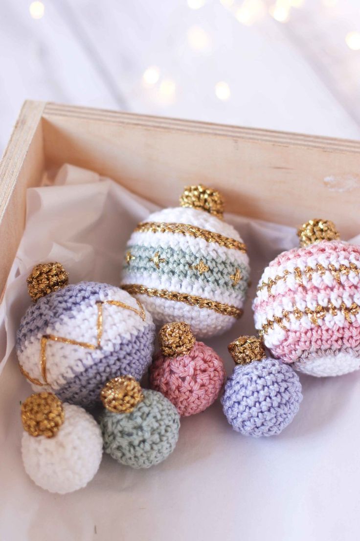 small crocheted ornaments in a wooden box