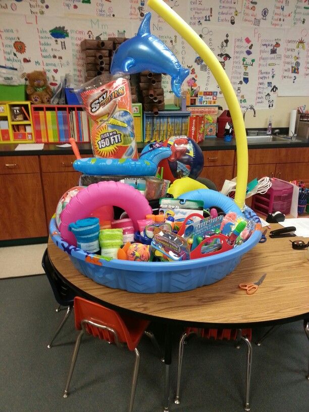 an inflatable toy boat on a table with other toys and supplies around it