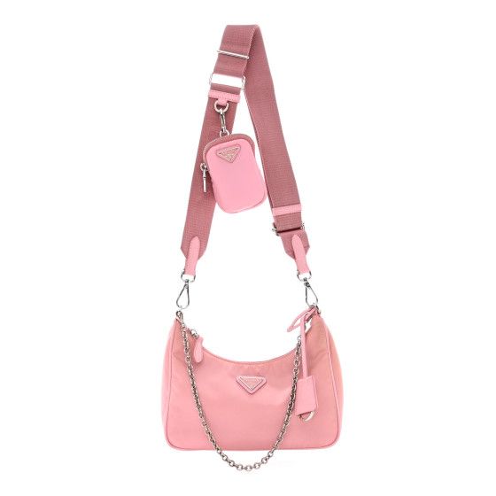 This is an authentic PRADA Nylon Re-Edition 2005 Shoulder Bag in Rosa. This petite messenger bag is crafted of pink nylon with polished silver hardware. It features saffiano cross-grain leather trim an adjustable pink nylon crossbody strap, a silver chain strap, and a removable coin purse. The top zipper opens to a pink Prada monogram jacquard interior. Trendy Pink Shoulder Bag With Silver-tone Hardware, Pink Nylon Bag With Detachable Strap, Pink Nylon Shoulder Bag With Detachable Strap, Pink Nylon Shoulder Bag With Adjustable Strap, Pink Crossbody Shoulder Bag With Silver-tone Hardware, Prada Nylon Re Edition, Pink Prada, Leopard Print Tote, Prada Re Edition