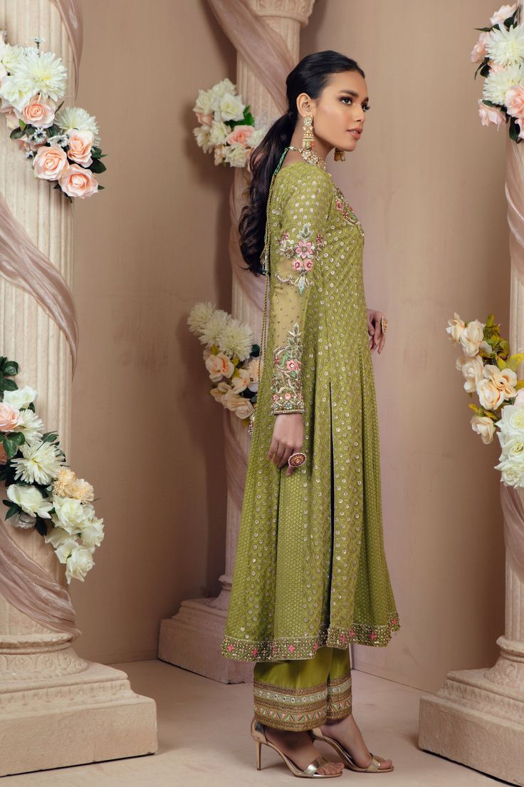 Emira | Pakistani Designer Outfit | Sarosh Salman Green Sharara With Straight Kurta For Reception, Green Kurta With Mirror Work And Traditional Drape, Green Salwar Kameez For Eid Reception, Anarkali Pista Green Sharara With Mirror Work, Pista Green Anarkali Sharara With Mirror Work, Green Churidar With Mirror Work In Traditional Drape, Green Kundan Sharara For Eid, Green Churidar With Mirror Work, Green Floor-length Churidar For Reception