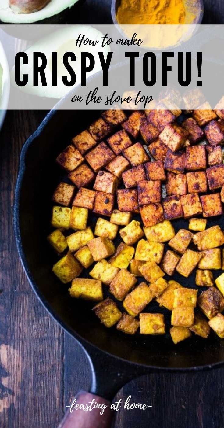 crispy tofu in a cast iron skillet with the words how to make crispy tofu on the side