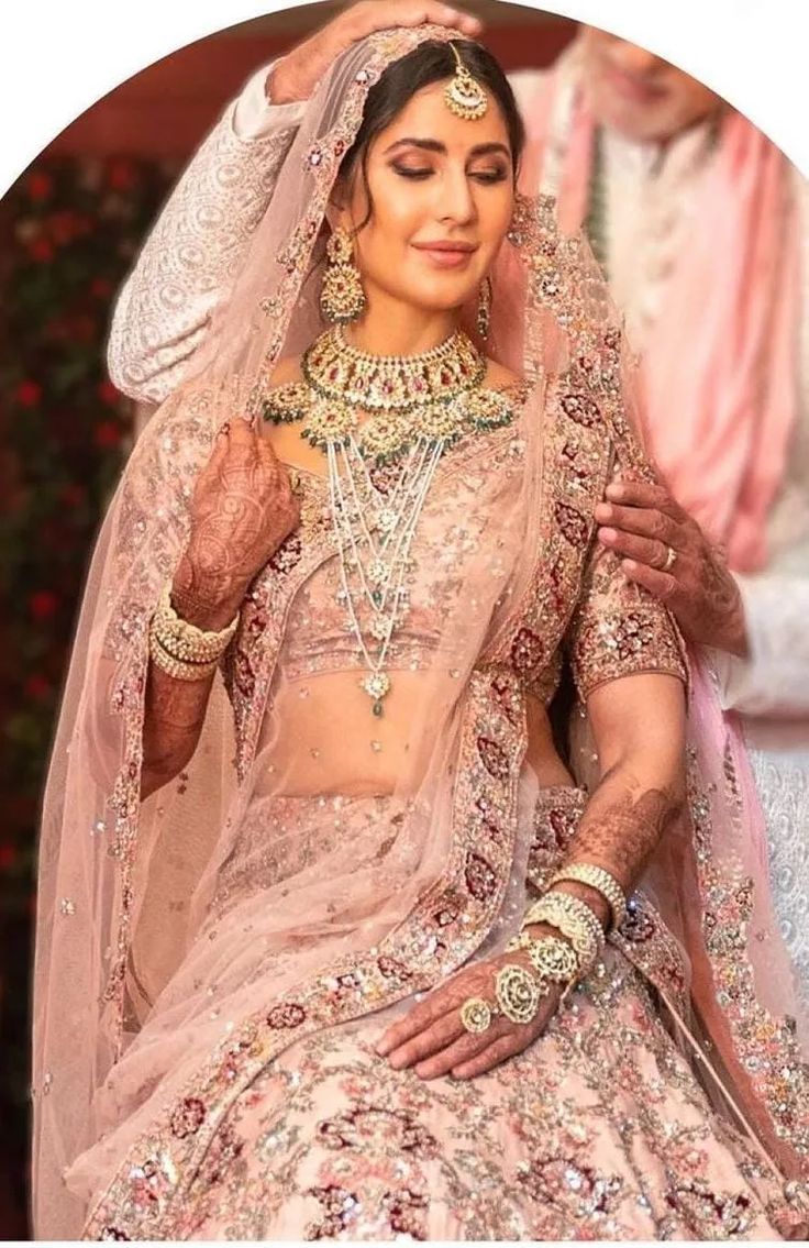 a woman in a pink bridal gown