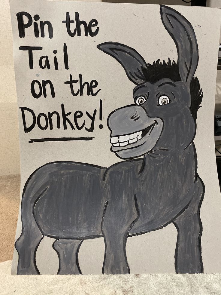 a sign with a donkey drawn on it that says pin the tail on the donkey