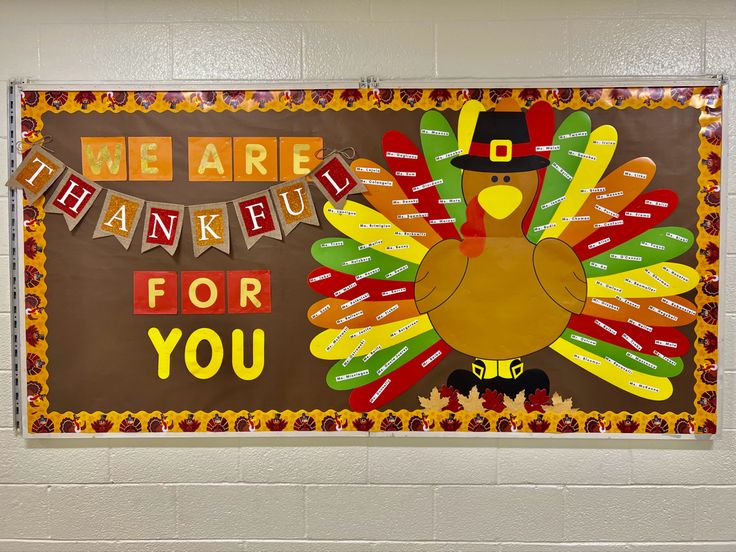 a bulletin board that says we are grateful for you with a turkey and pilgrim hat on it