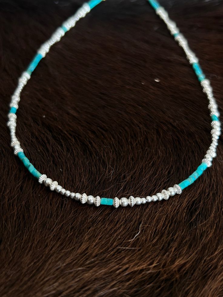 "This delicate looking choker will be a gorgeous addition to any style of clothing. It is made with 2mm Kingman turquoise heishi beads and a variety of 925 sterling silver beads. Length is 15 3/4\" $57 Item 725B" Silver Heishi Beads Hand-strung Jewelry, Silver Heishi Bead Jewelry, Silver Heishi Beads Jewelry Hand-strung, Adjustable Turquoise Necklace With Silver Beads, Kingman Turquoise, Heishi Beads, Sterling Silver Bead, Chain Styles, Sterling Silber