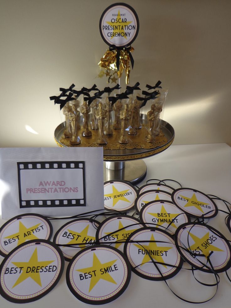 a table topped with lots of cupcakes and cookies