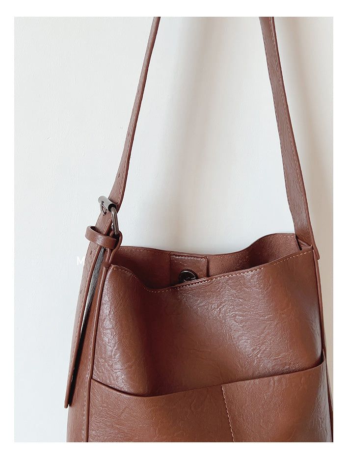 2024 new style. Simple leather tote bag. Material: High Quality PU Leather Size approximately 12.2"H x 11.4"W x 3.9"D Designer Style ID: 8762 Leather Tote Bag with Shoulder Strap and Inner Pouch Fall Bucket Shoulder Bag With Removable Pouch, Brown Square Bucket Bag With Leather Handles, Fall Bucket Satchel With Adjustable Strap, Fall Large Capacity Bucket Satchel, Brown Bucket Satchel With Large Capacity, Large Capacity Brown Faux Leather Bucket Bag, Brown Large Capacity Bucket Satchel, Brown Faux Leather Bucket Bag With Large Capacity, Brown Faux Leather Large Capacity Bucket Bag