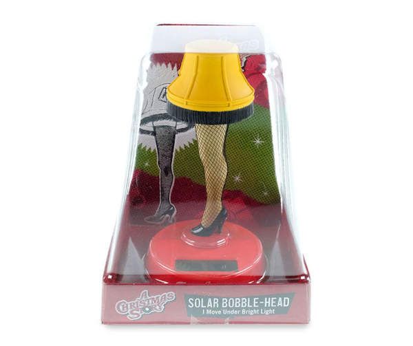 a doll in a plastic box with a lamp on it's head and legs