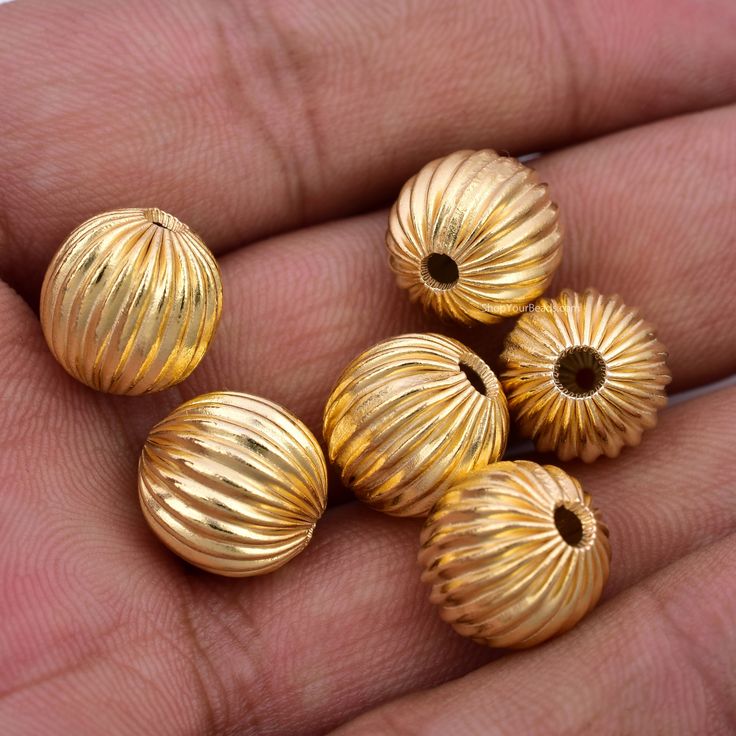 Beautiful Real Gold plated Corrugated Ball shape beads, made of solid copper and plated with Real Gold Size: 12x12mm Hole: 2.5 to 3mm (100% handmade product) Qty: 6 pieces Material: Real Gold plated over Copper SKU# 1045 Our products are not suitable for children of all ages. keep away from children's reach --------------- Luxury Yellow Gold Chandbalis For Festivals, Luxury Heavy Gold Chandbalis, Luxury Traditional Yellow Gold Chandbalis, Gold Balls Designs, Gold Beads Designs, Luxury Gold Beads For Party, Cheap Gold Beads For Festival, Traditional Gold Beads For Festive Occasions, Gold Beads For Diwali