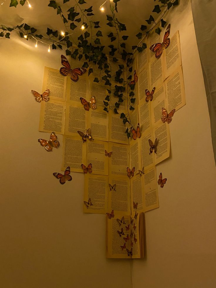 the butterflies are flying over the open book on the wall above the bookshelf