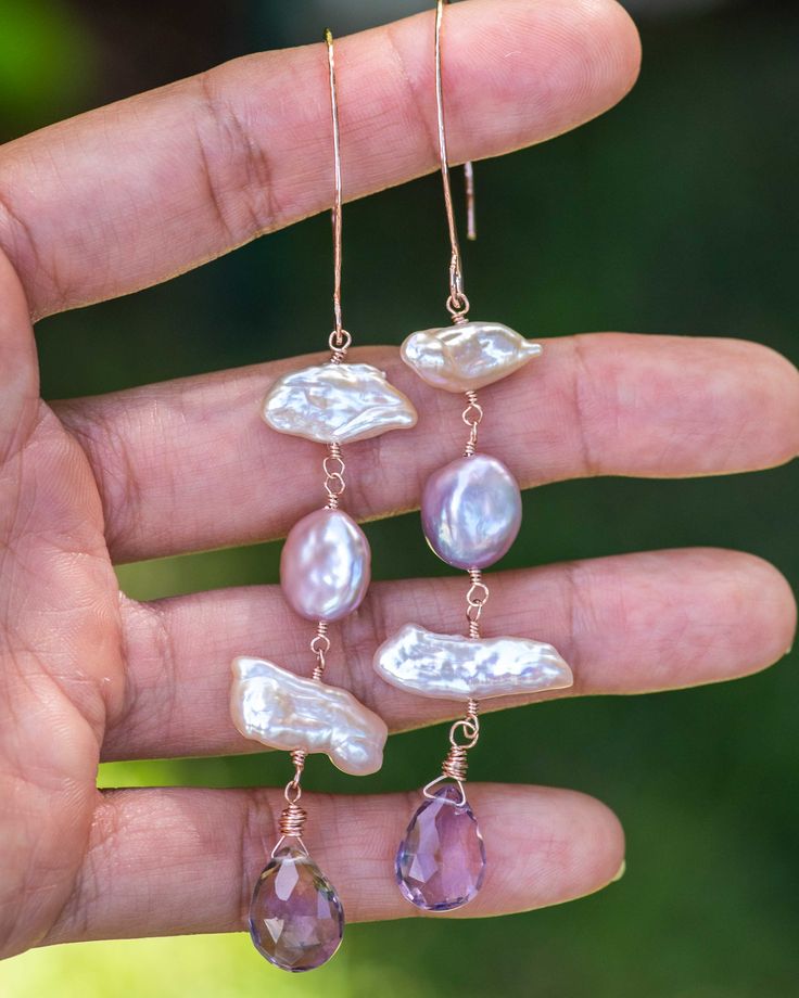 These luxuriously lustrous Biwa & Coin Pearl Ametrine Earrings are an ideal choice for the modern woman looking to add a delicate yet striking aesthetic to her outfits. The subtle lilac hues of the coin pearls combined with the mesmerizing hues of the ametrine lend a soft yet eye-catching elegance to any ensemble. These truly need to be appreciated in person. Details: - Biwa pearls, Coin pearls, Ametrine - 14/20 rose gold filled - Handmade earwires - Earrings measure 3 3/4 inches in length and a Elegant Amethyst Earrings With Natural Stones, Elegant Purple Gemstone Pearl Earrings, Elegant Amethyst Pearl Drop Earrings, Elegant Amethyst Earrings With Pearl Drop, Elegant Amethyst Earrings As A Gift, Elegant Lavender Earrings With Ear Wire, Elegant Pink Amethyst Earrings, Elegant Purple High Luster Jewelry, Elegant High Luster Purple Jewelry