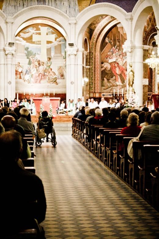 people are sitting in pews at a church