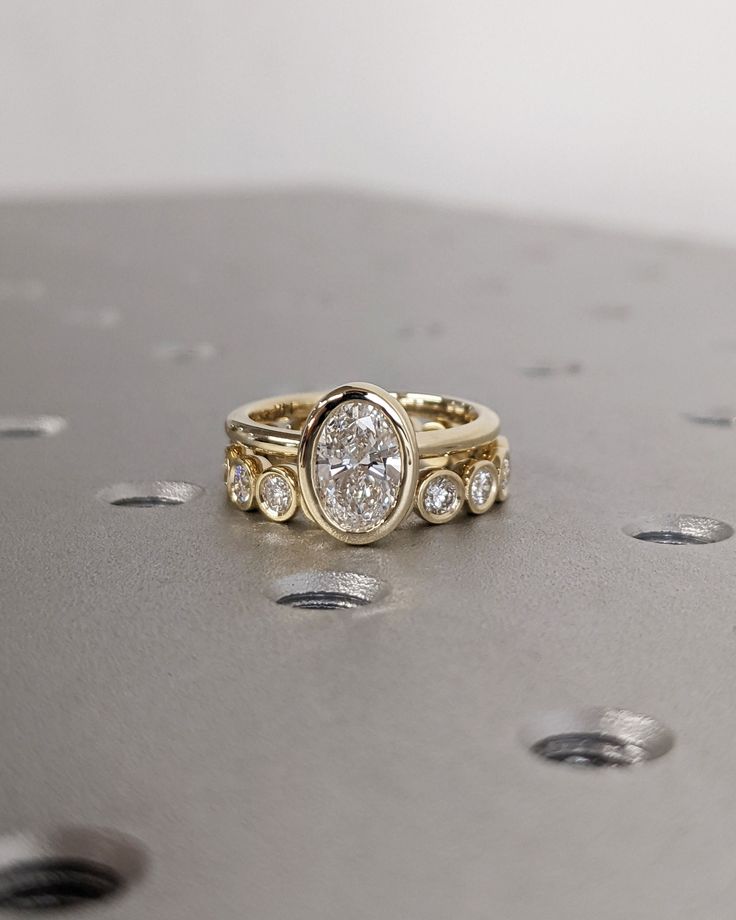 a close up of a ring with diamonds on the bottom and in between it's sides