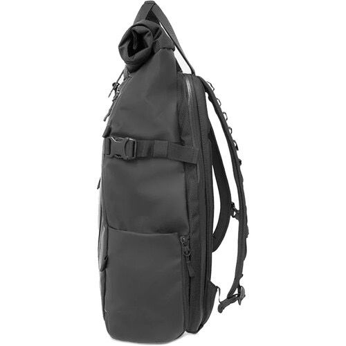 The PRVKE 21L Backpack v2 by WANDRD, shown here in black, was developed as a result of user feedback and an update to their storied collection of backpacks. The bag is subdued cool and infinitely useful for any adventure or daily use. It has a sleek minimalist style and thoughtful design improvements. Intended to hold an assortment of stuff, tech, and individual effects, it has a 21L limit and the roll top conclusion grows to make additional room in the event that you want it. A side opening let Travel Camera Bag, Photo Backpack, Multicam Black, Travel Camera, Camera Backpack, Luggage Organization, Tablet Sleeve, Roll Top, Instant Camera