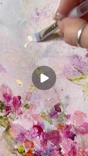 someone is painting flowers with acrylic paint