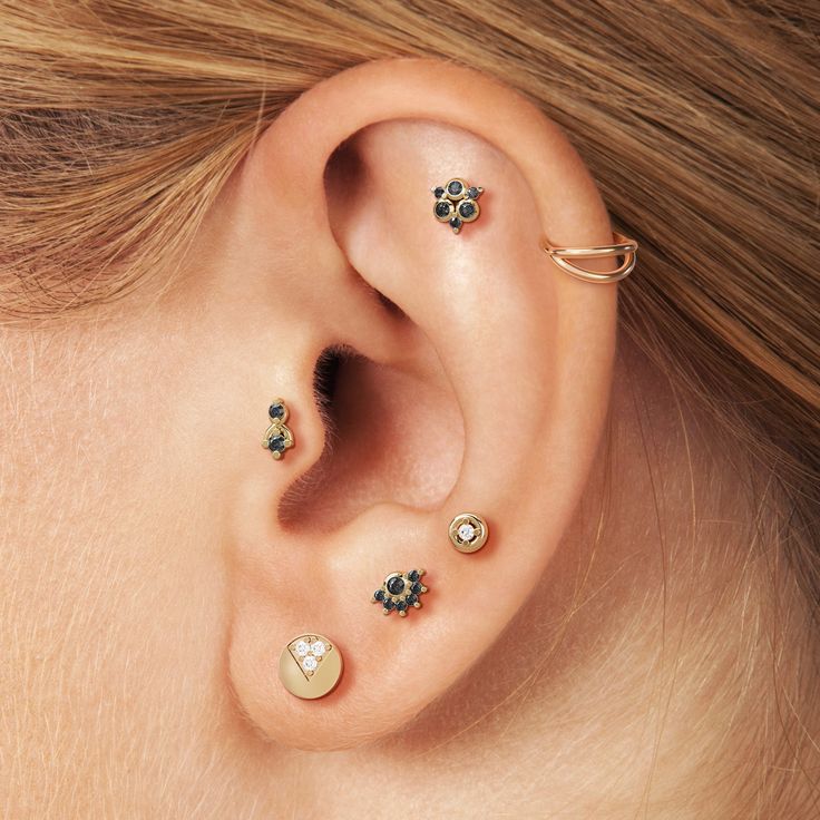 Elevate your cartilage jewelry collection with an elegant diamond stud earring. Crafted from 14k solid gold, this modern and minimalist design features a cluster of bezel-set and prong-set black diamonds totaling 0.045 carats. Chic and comfortable, it's the perfect accessory for adding a touch of sophistication to your everyday style.The threaded screw pin earring post is easy to insert and remove, and the flat back makes it comfortable to wear. Our screw pin flat back earring studs are made of Tragus Hoop, Daith Jewelry, Helix Jewelry, Tragus Jewelry, Cartilage Jewelry, Labret Studs, Septum Jewelry, Flat Back Earrings, Nose Jewelry