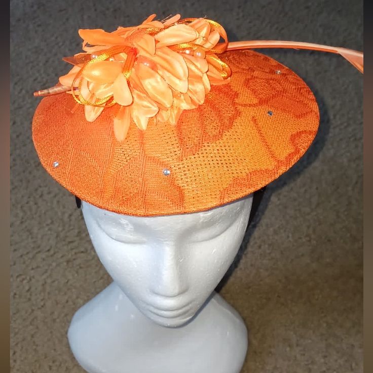 2 Orange Fascinator Styles With Gems And Feathers Orange Fascinator For Spring Races, Orange Spring Fascinator For Races, Orange Spring Races Fascinator, Spring Races Orange Fascinator, Summer Orange Fitted Fascinator, Spring Formal Fitted Mini Hats, Orange Mini Hats For Summer Parties, Orange Spring Evening Fascinator, Fitted Orange Mini Hats For Summer