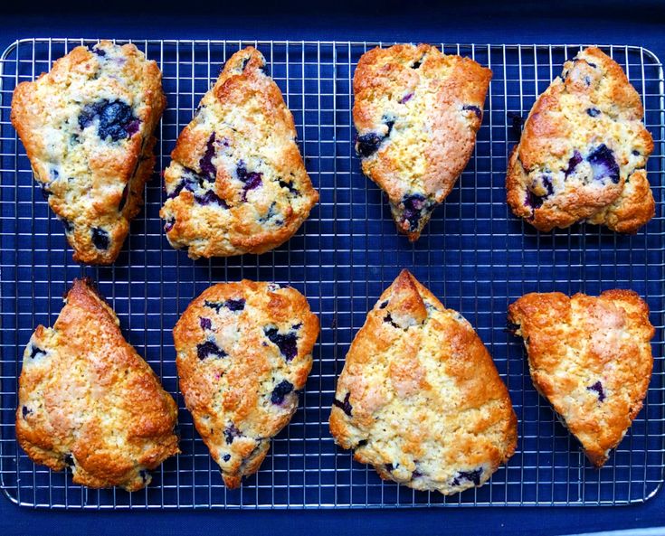 nine blueberry scones on a cooling rack