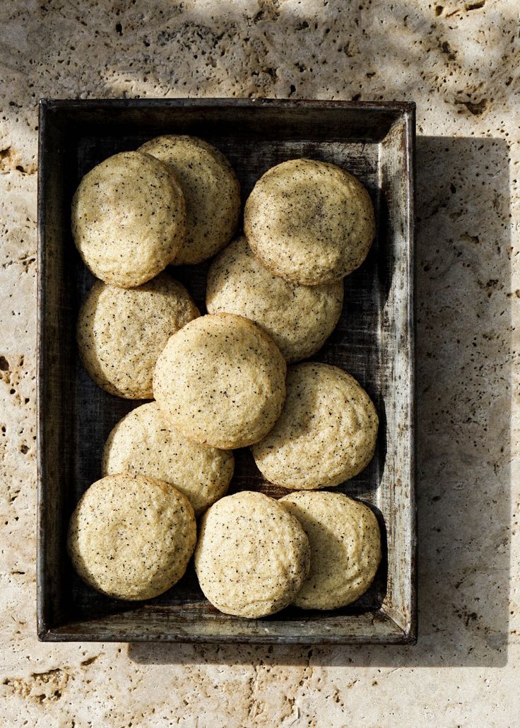 a wooden box filled with cookies on top of a counter