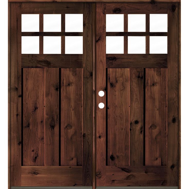 a wooden door with two sidelights on the top and bottom panels, in front of a white background