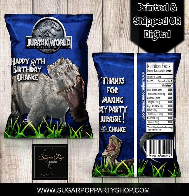 two bags of dinosaur birthday cake next to each other on a wooden background with the label printed and shipped or digital