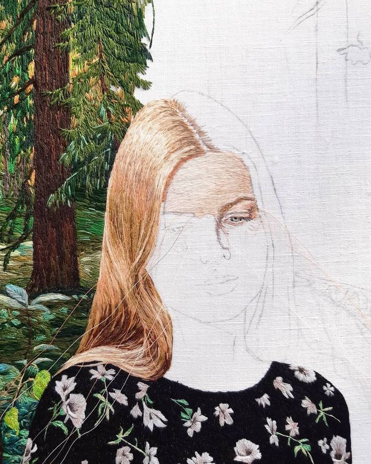 a drawing of a woman's face with trees in the background