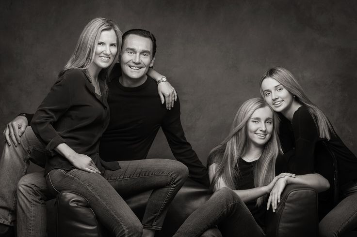 a family posing for a black and white photo