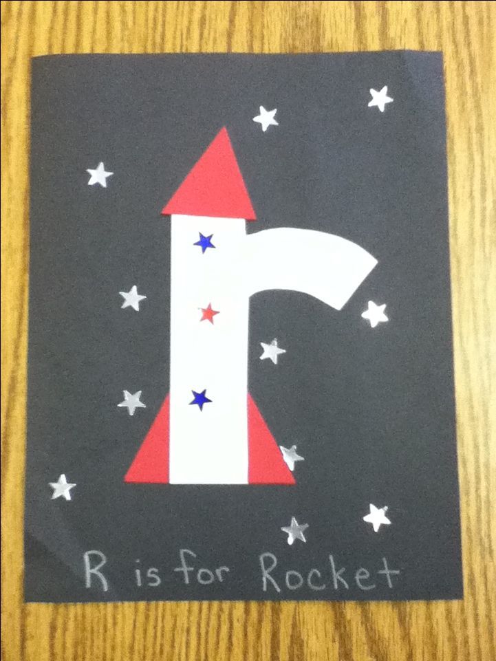 the letter i is for rocket painted on a piece of paper with stars around it