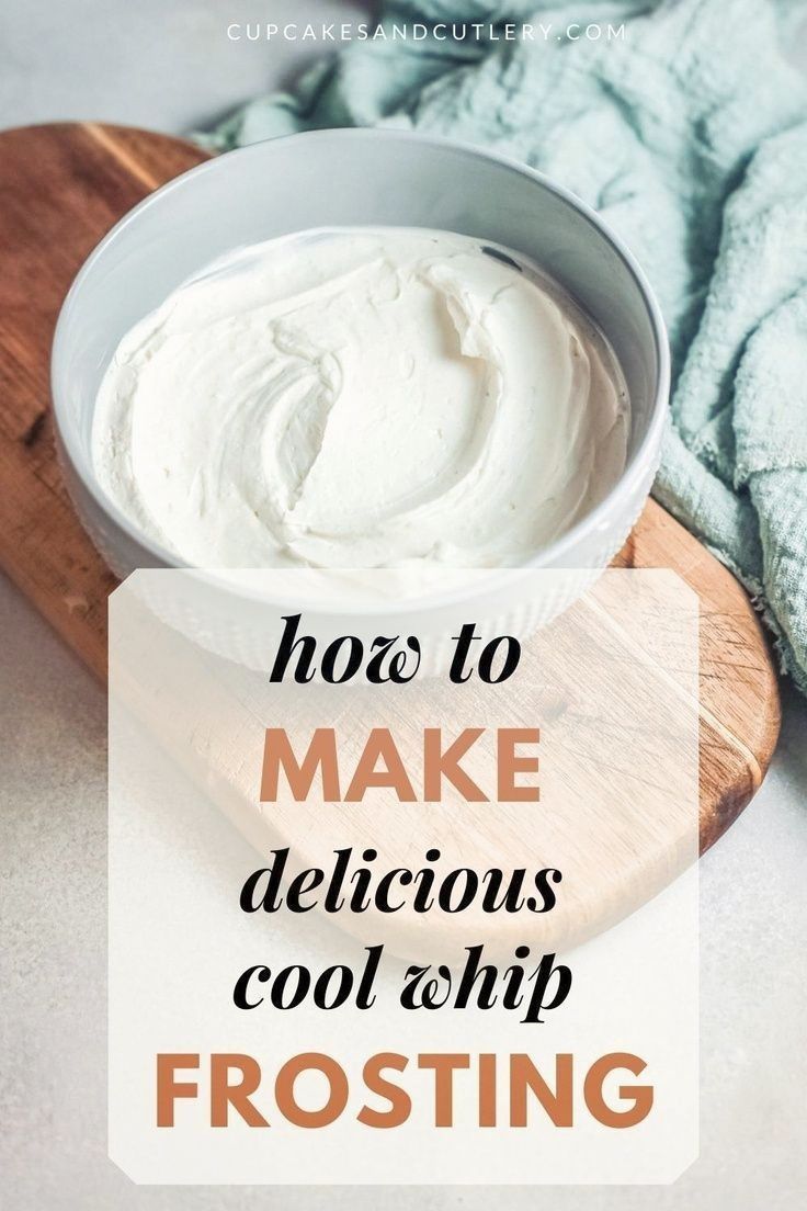 a white bowl filled with cream sitting on top of a wooden cutting board next to a blue towel