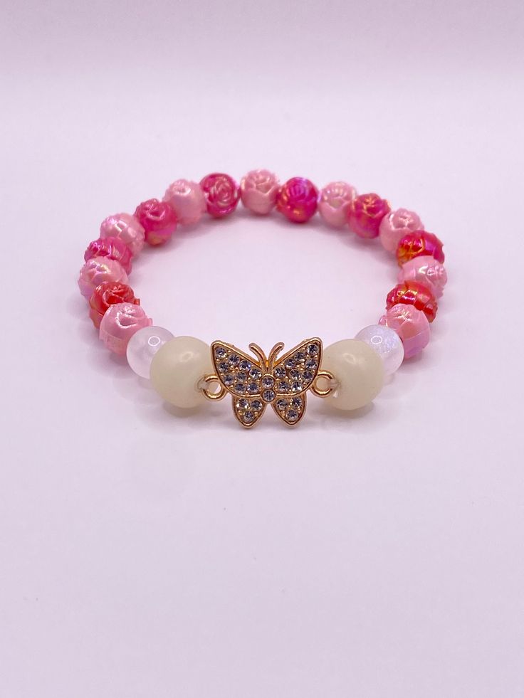 Beautiful handmade beaded bracelet with butterfly pendant White Butterfly Charm Bracelet For Gift, Pink Butterfly Charm Bracelet Jewelry, White Butterfly Bracelet For Gift, Elegant Jewelry With Butterfly Charm And Round Beads, Pink Butterfly Charm Bracelet, Butterfly Charm Beaded Bracelet For Gifts, Butterfly Shaped Beaded Bracelet For Gift, Beaded Bracelets With Butterfly Charm As Gift, Adjustable Butterfly Charm Bracelet