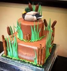 there is a cake that looks like a duck sitting on top of a fenced in area