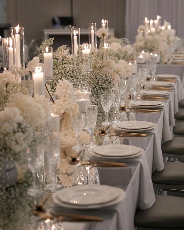 a long table is set with candles and flowers for an elegant wedding reception at the four seasons hotel