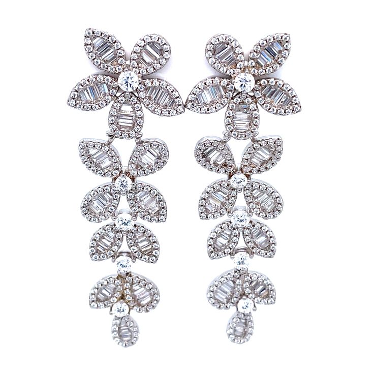 These formal flower earrings definitely have the WOW factor. With this amount of sparkle and glam, it's no wonder they're a fan favorite! Sterling silver Tricolor tone Cubic zirconia Post back SIZE Length about 2" Style Code: PJER417 Sterling Silver Flower-shaped Diamond Earrings For Formal Events, Silver Sparkling Flower-shaped Earrings, Elegant Flower-shaped Earrings With Rhinestones, Elegant Flower-shaped Rhinestone Earrings, Sparkling Flower-shaped Cubic Zirconia Earrings, Silver Statement Earrings, Adjustable Bangle, Fine Earrings, Personalized Bracelets